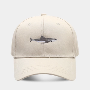 Close-up of gray shark embroidery on khaki cotton twill baseball cap with stitch detail
