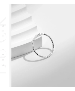 Macro shot of S925 sterling silver ring featuring a sparkling diamond-cut texture finish