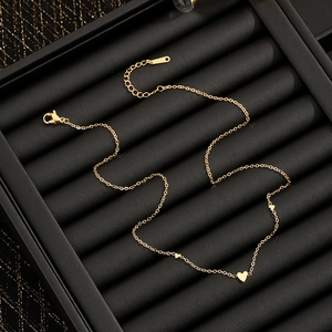 Titanium steel heart bracelet in gold finish displayed in a luxury black jewelry box