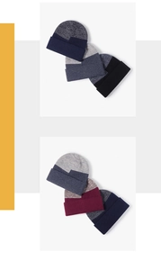 Detailed view of color-block knit beanie texture and elastic rolled cuff design