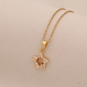Gold necklace with hollow star pendant featuring sparkling clear zircon insets