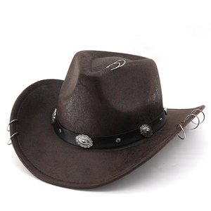 Close-up of vintage brown suede cowboy hat with leather band and metal floral studs