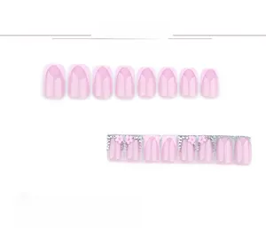 Detail of pink French press-on nails set with glitter, 3D flower and rhinestone accents