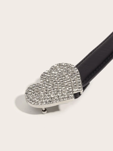 Detail of black leather belt featuring double interlocking heart buckles with shiny rhinestones