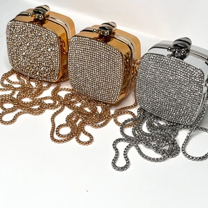 Mini rhinestone round crossbody bags in gold and silver finish with metal chain strap