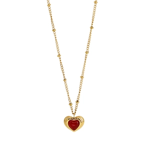 Golden heart necklace with red agate pendant and small gold beads on a fine chain