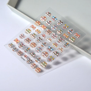 Macro detail of FEB-799 5D embossed nail stickers featuring colorful lion dance patterns