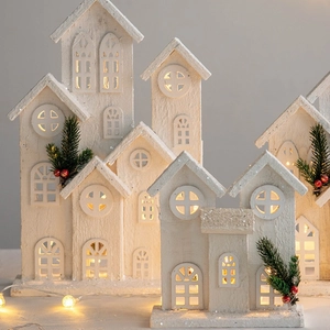 Lighted wooden Christmas house set with warm LED glow and white snow finish for decor
