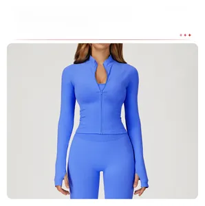 Detail of royal blue slim-fit zip-up yoga jacket with ribbed texture and thumbhole cuffs