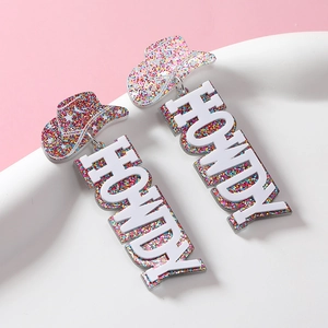 Acrylic cowboy hat earrings with Howdy charms and colorful glitters on pink background