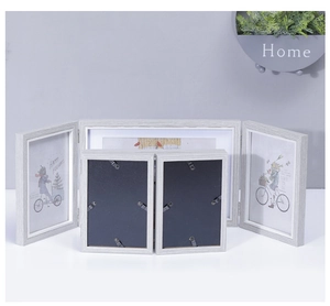 Detail of grey wood grain texture on foldable Nordic style triple photo frame set