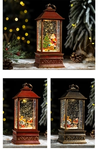Detail of vintage Christmas snow globe lantern with Santa Claus and festive glitter
