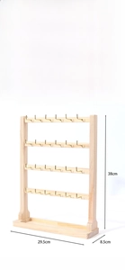 Detail view of a 4-tier solid wood jewelry display stand with dimensions 38x29.5x8.5cm