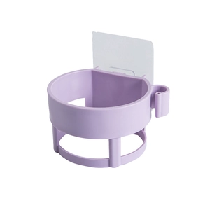 Wall-mounted hair dryer holder in purple plastic with adhesive hook for bathroom storage