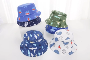 Detailed close-up of five patterned summer sun hats for kids with marine life themes