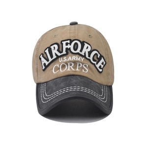 Detail of military embroidery and white double stitching on distressed khaki baseball cap