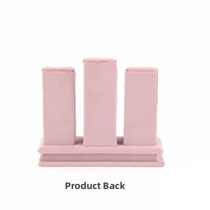 Detailed back view of pink velvet three-pillar jewelry display stand with a rectangular base
