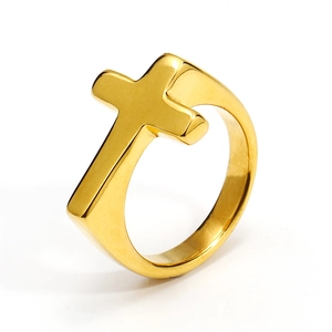 Macro side view of golden cross ring showing polished finish and thickness on white backdrop