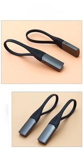 Minimalist silicone key ring detail featuring embossed logo and matte metal hardware