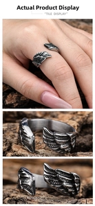 Macro detail of vintage angel wing open ring with oxidized stainless steel texture