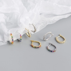 Close-up of S925 silver U-shape hoop earrings with rainbow stones and hallmark