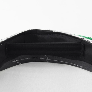 Detail of internal elastic band and reinforced stitching on green sequin captain hat
