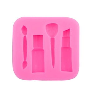Pink silicone mold featuring lipstick and makeup brush shapes for fondant and chocolate