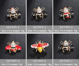 Detail view of 3x2.4cm honey bee brooches with colorful enamel and rhinestone inlay
