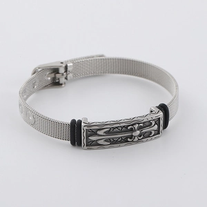 Silver mesh steel bracelet with central cross relief and black rubber accents on a grey background