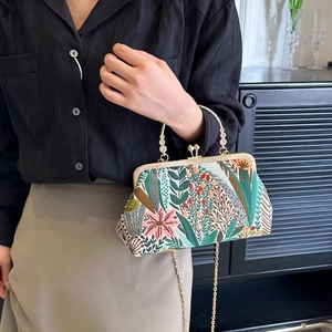 Vintage floral embroidery handbag with chain strap in green and beige, handheld view