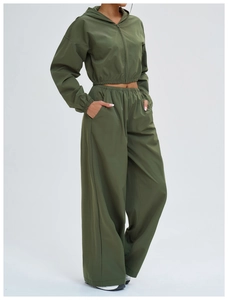 Detail view of the olive green sports sun protection suit with zip hoody and wide pants