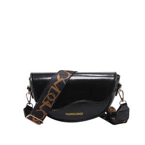 Classic black leather saddle bag for women with a patterned wide shoulder strap