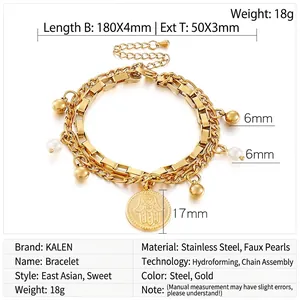Detail view of gold stainless steel double-layered bracelet with Hamsa palm pendant
