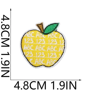 Artistic yellow apple embroidery patch with ABC 123 pattern and green leaf detail