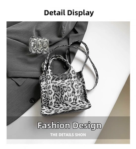 Detail view of leopard print mini tote bag with handle and slim shoulder strap