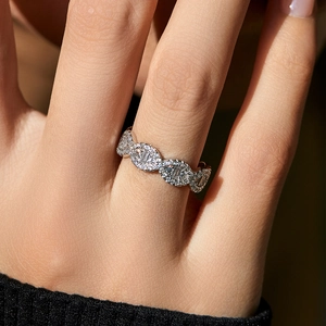 Elegant S925 sterling silver ring with oval diamond links worn on a finger