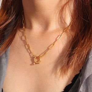 Detail of 18K gold plated paperclip chain necklace with a round mariner spring clasp