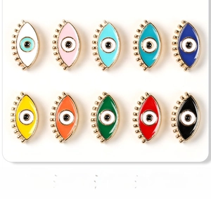 Set of ten colorful enamel evil eye jewelry charms with gold metal eyelash details