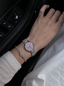 Elegant silver stainless steel watch with pink dial paired with diamond accessories