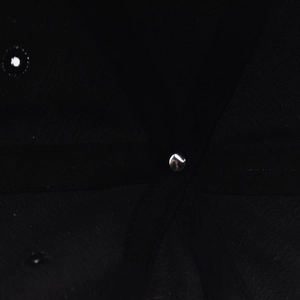 Macro detail of black baseball cap inner top with silver rivet and reinforced stitching