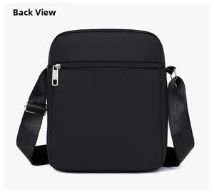 Detailed back view of black waterproof crossbody bag showing zipper pocket and strap