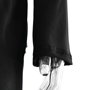 Close-up of the double-needle stitched cuff on this elegant black evening gown
