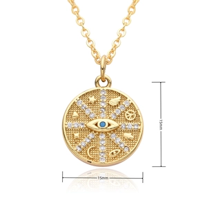 Macro detail of 15mm gold-plated celestial pendant featuring stars, moon and blue stone