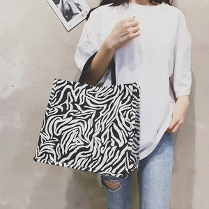 Stylish zebra print tote bag for women made of durable canvas material for daily shopping