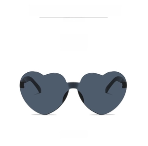 Detailed view of heart-shaped rimless sunglasses with premium black gray lenses