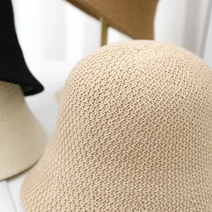 Breathable knitted bucket hat for women in beige with a stylish handmade woven texture