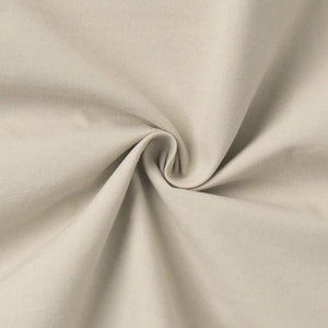 Detail of light beige textile fabric texture with fine plain weave and smooth drape