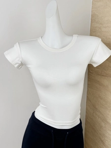 Detailed macro view of white ribbed fabric texture on a slim-fit crew neck modal sports T-shirt