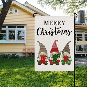Detail view of linen garden flag with red plaid Christmas gnomes and Merry Christmas text