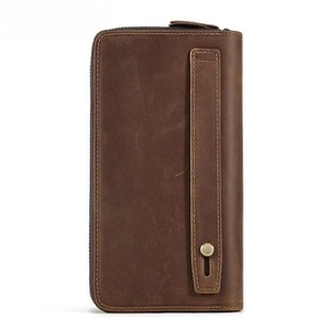 Detailed back view of vintage brown leather wallet with reinforced handle and metal hardware